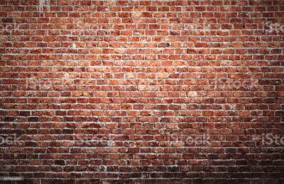 Old brick wall background with vignette effect.